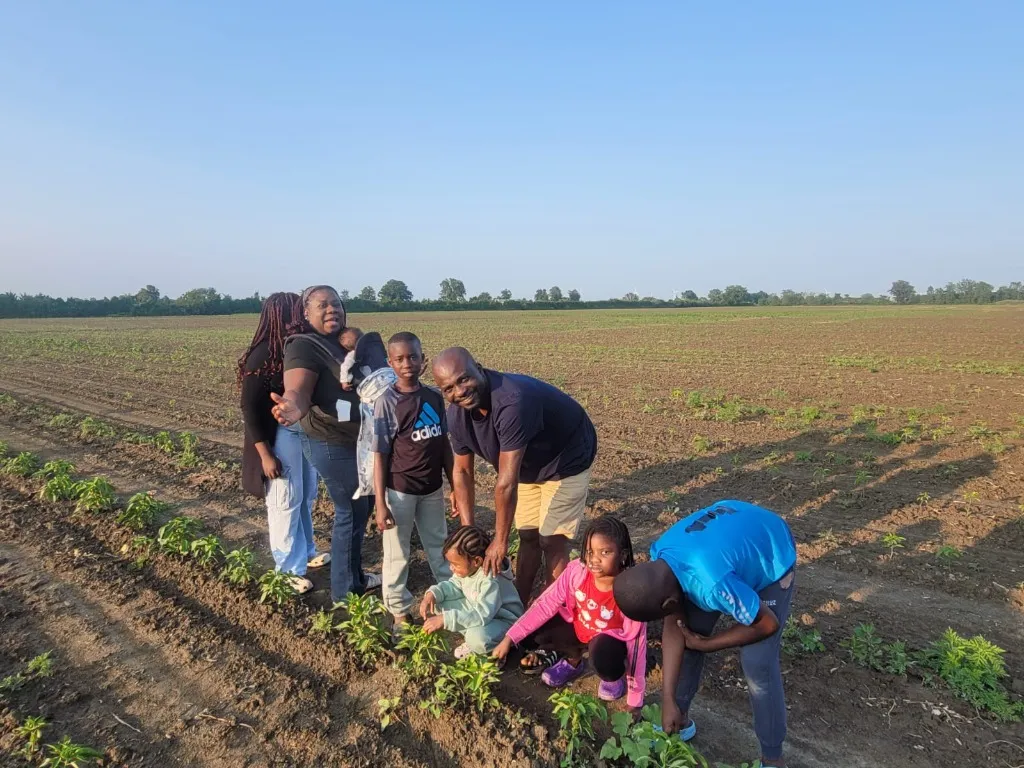 Family in the farm field at RESOLVEFARM